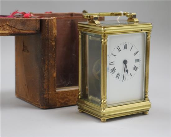 A gilt-brass carriage timepiece, with white enamelled Roman dial and leather outer case